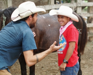 Enjoying cleaning the heck out of our horse Negro at Big Sky Ranch Nicaragua